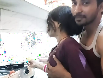 Hot Indian teenage with big knockers gets frisky in the kitchen with her bf