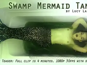 Lucy LaRue plays the calling be fitting of a Swamp Mermaid Tank in a super-hot solo fun and games